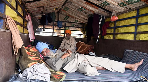 Farmers taking rest inside their vehcile at Ghazipur Delhi-UP border in New Delhi. (Photo | EPS/Parveen Negi)