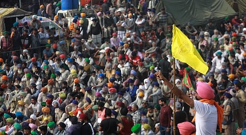 Farmers shouting slogans during their Delhi Chalo protest march against the new farm laws at Singhu border in New Delhi on Monday. (Photo | Shekhar Yadav/EPS)
