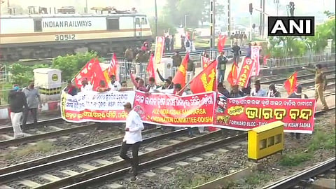 Protesters block railway tracks in Bhubaneswar during the Bharat Bandh on Tuesday (Photo | Twitter/ANI)
