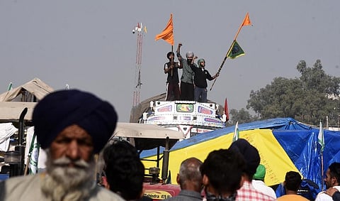 Farmers raise slogans at Singhu border during Delhi Chalo protest against the new farm laws in New Delhi Tuesday. (Photo | Parveen Negi, EPS)