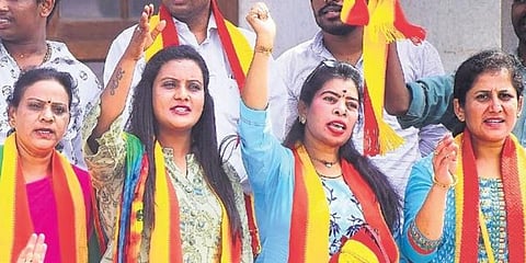 Members of Karnataka Kendritha Rajakarana stage a protest in  front of Town Hall demanding employment reservation on Sunday. (Photo | Pandarinath B, EPS)