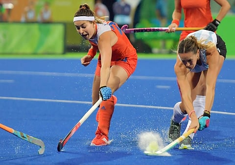 Argentina's Victoria Zuloaga (R) vies with Netherlands' Eva de Goede. (Photo | AFP)