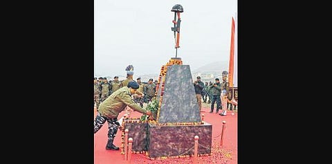 CRPF personnel pay tribute at a memorial to the 40 jawans who were killed in the Pulwama attack last year at Letaporain Pulwama district of Kashmir. (Photo | PTI)