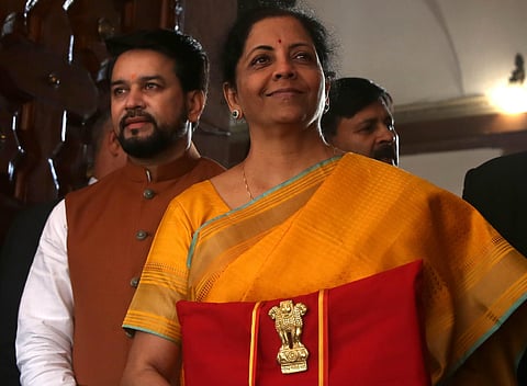 Union Finance Minister Nirmala Sitharaman with MoS Finance Anurag Thakur holds a folder containing the Union Budget documents at the Parliament House. (Photo| Shekhar Yadav, EPS)