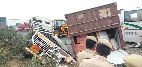 The incident happened at 3 AM on Thursday.  The bus had left Tirupur and was entering Coimbatore when the mishap occurred. The preliminary information was that the tyres of the container lorry  burst and it lost control . The lorry then hit the divider be