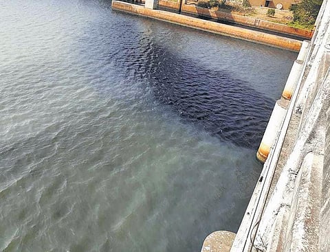 The black Periyar water  under Pathalam bridge