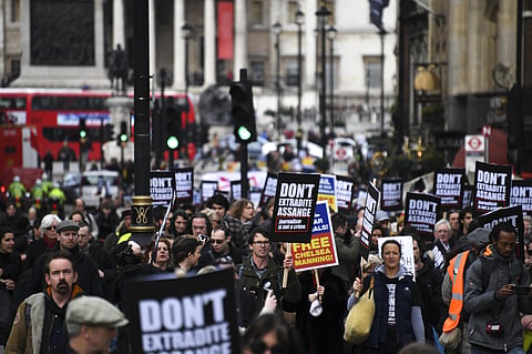 Demonstrators march to protest against the extradition of Wikileaks founder Julian Assange, in London, Saturday, Feb. 22, 2020. (Photo | AP)