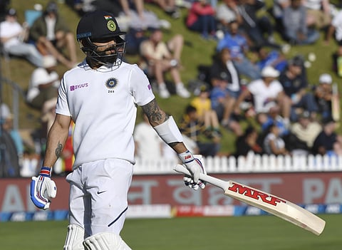India's Virat Kohli walks, out for 19 to New Zealand's Trent Boult during the first cricket test between India and New Zealand at the Basin Reserve in Wellington, New Zealand. (Photo | AP)