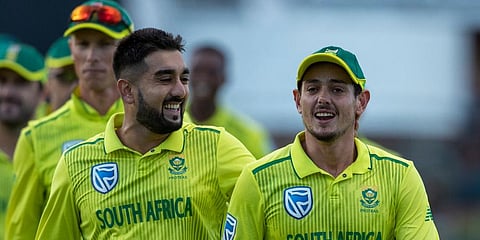 South Africa's bowler Tabraiz Shamsi, left, and captain Quinton de Kock leave the field at the end of the 2nd T20 cricket match between South Africa and Australia at St George's Park in Port Elizabeth. (Photo | AP)