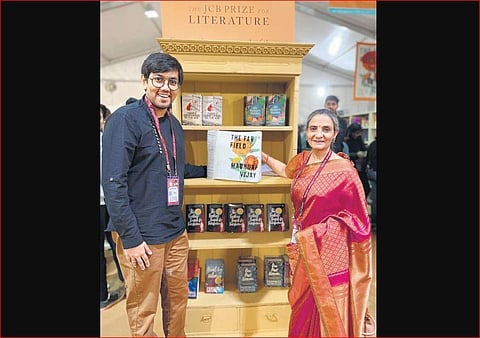 Siddhant Shah, founder of Access for All, with Mita Kapur with the Braille copy of The Far Field.