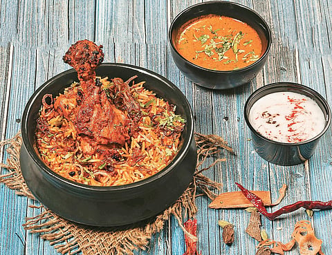 (From left) A few dishes from Verandah Handcrafted; Pandu’s Pav Bhaji, Chicken Dum Biryani, and Multani Hara Bhara Kebab
