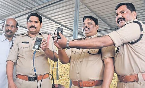 GRP officials demonstrating mobile security check devices at GRP SP’s office in Vijayawada on Thursday. (Photo| EPS/P Ravindra Babu)
