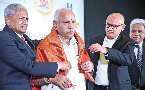 Chief minister B S Yediyurappa being felicitated at a conference on Approaches to shaping Climate Resilient Agriculture in Bengaluru  on Friday | nagaraja Gadekal