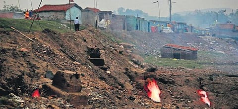 Flames rises from fissures in coal mines in Jharkhand’s Jharia | file