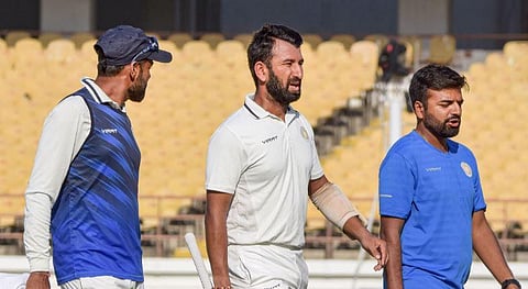 Cheteshwar Pujara took medical help twice during his brief stay before retiring ill on Day 1 of the Ranji Trophy final at SCA Stadium in Rajkot on Monday | PTi
