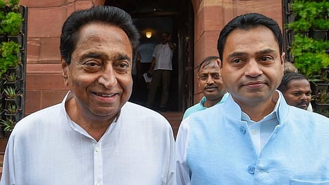 Former Madhya Pradesh Chief Minister Kamal Nath (L) with his son and MP Nakul Nath. 