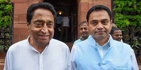 Madhya Pradesh CM Kamal Nath (L) with his son and MP Nakul Nath 