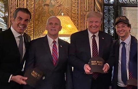 Wajngarten posted a picture of himself standing next to Trump and wearing a hat reading 'Make Brazil Great Again,' on Instagram. In the picture, Trump, who is holding a similar hat, is standing next to Vice President Mike Pence. (Photo | @fabiowajngarten,