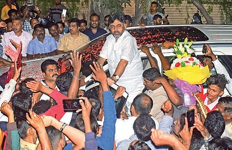 Supporters hail Congress leader D K Shivakumar in front of his residence, after he was appointed as the KPCC president in Bengaluru on Wednesday | Pandarinath B