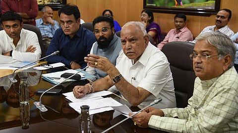 Karnataka CM Yediyurappa chairs a high-level  meeting  on coronavirus with ministers and officials at Vidhan Soudha in Bengaluru on Friday. (Photo | EPS/Nagaraja Gadekal)