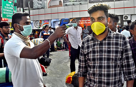 Thermal Testing been performed to a passenger who travel by train at Chennai central railway station on Monday. (Photo | Ashwin Prasath/EPS)