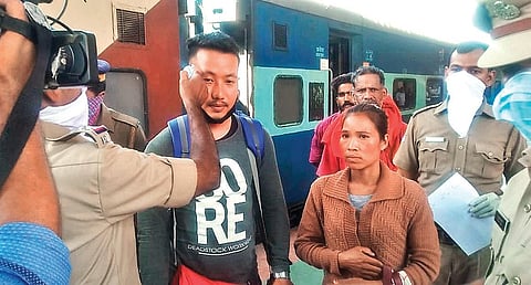 Health department and RPF personnel screening passengers with thermal scanners at the exit point of Palakkad Junction railway station on Monday  | Express