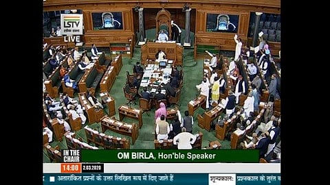 Lok Sabha witnessed protests by Opposition MPs who stormed the well raising slogans against the govt over Delhi violence. (Photo | ANI)