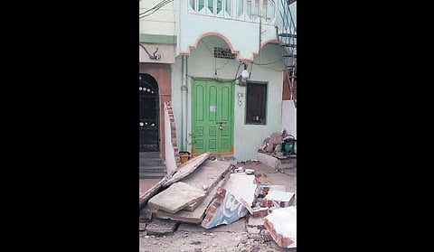 The debris of a wall that collapsed during the Pattana Pragathi  works at Kotthur Janda in Hanamkonda on Sunday