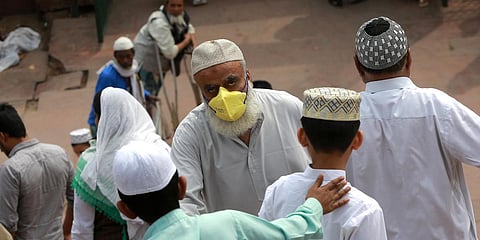 People, wearing facemasks amid concerns over the spread of the COVID-19, visit the Jama Masjid mosque in New Delhi. (Photo| Shekhar Yadav, EPS)