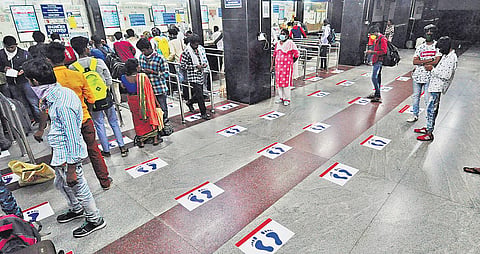 Footmark stickers at booking counters in Vijayawada Railway Station