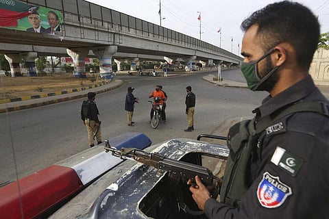 Pakistani police officers stop travelers after a government announced to lockdown the city due to concerns over the spread of the new coronavirus, in Karachi, Pakistan, Monday, March 23, 2020. (Photo | AP)