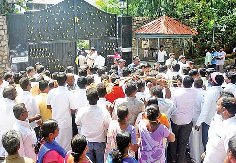 File photo of AIADMK workers in front of Veda Nilayam at Poes Garden to catch a glimpse of AIADMK general secretary  V K Sasikala on Saturday | d sampathkumar