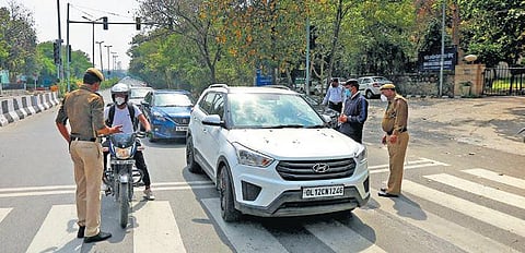 Police check commuters in New Delhi during the lockdown. (Photo | Shekhar Yadav, EPS)