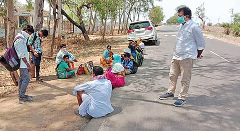 Andole MLA Chanti Kranti Kiran speaks to tribals from Narayankhed during their journey on foot near Jogipet on Thursday