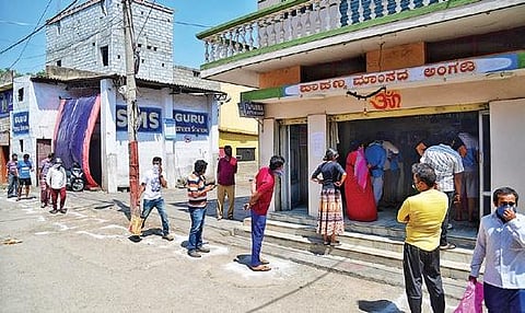 People maintain distance while in queue outside Papanna mutton stall in Byatarayanapura in Bengaluru on Thursday. Mutton is a favoured meat a day  after Ugadi  I SHRIRAM BN