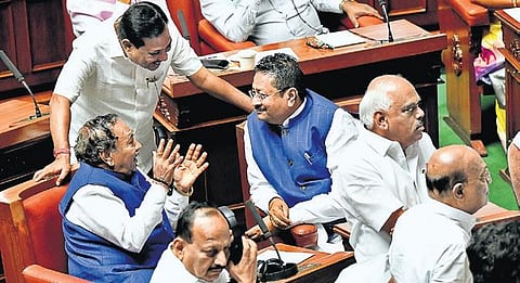 BJP MLA Basangouda Patil Yatnal and Rural Development Minister KS Eshwarappa during the Assembly session at Vidhana Soudha on Monday  |Express