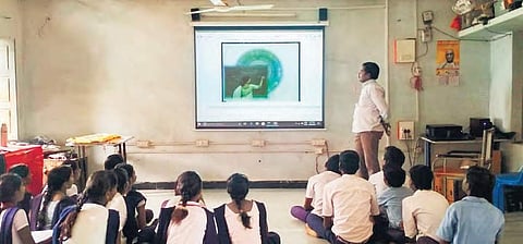 Students attend digital classes at one of the govt schools. | Express