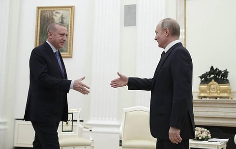 Russian President Vladimir Putin, right, and Turkish President Recep Tayyip Erdogan greet each other prior to their talks at the Kremlin in Moscow on Thursday. (Photo | AP)