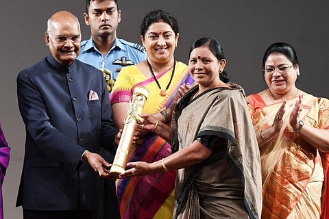 President Ram Nath Kovind presenting the NariShakti Puraskar 2019 to Ms Padala Bhudevi in Individual category for the development of tribal women, widows, Podu lands through a community-based organisation. (Photo | Twitter)