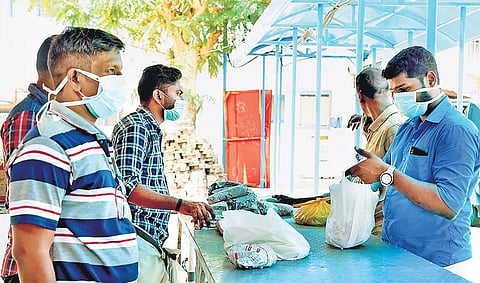 People wearing masks at Pathanamthitta General Hospital, where the  virus-infected family has been admitted. (Photo| EPS/SHAJI VETTIPURAM)