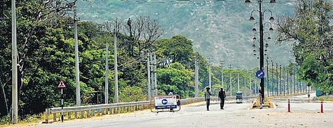 The usually busy Mysuru-Nanjangud Road wears a deserted look following the nationwide lockdown to contain the spread of COVID-19 | Udayshankar S