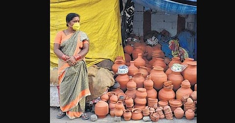 A vendor waits for customers in Kumahar Basti in Punjaguta | S Senbagapandiyan