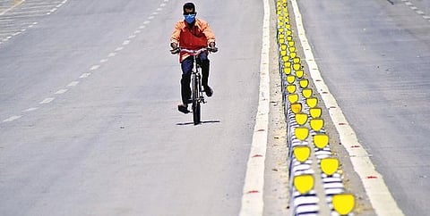 A lone cyclist on Bengaluru’s iconic MG Road on Monday | pandarinath b