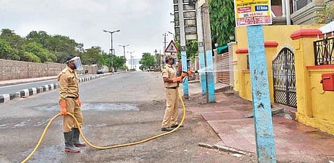 Health workers sanitise parts of Vijayapura on Monday I EXPRESS