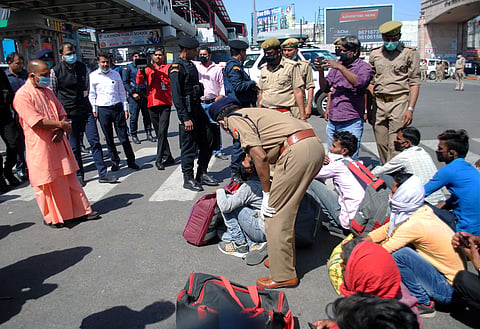 UP Minister Yogi Adityanath meets migrant workers in Lucknow (File photo| PTI)