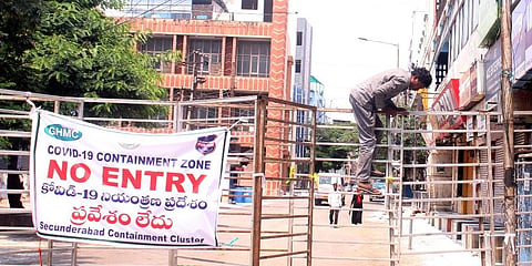 A man seen jumping the barricade at containment zone at MG Road, Secunderabad. (Photo | Sathya Keerthi, EPS)