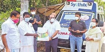 Dr Viju Jacob presenting the kit to panchayat president K K Raju