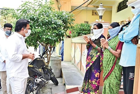 IT Minister KT Rama Rao interacts with residents of a containment zone at Vemulawada on Wednesday