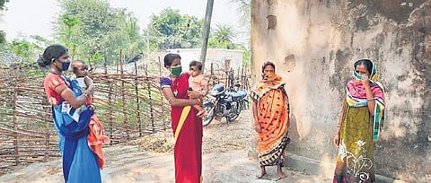 The women workers speaking to villagers about Coronavirus safety measures | express