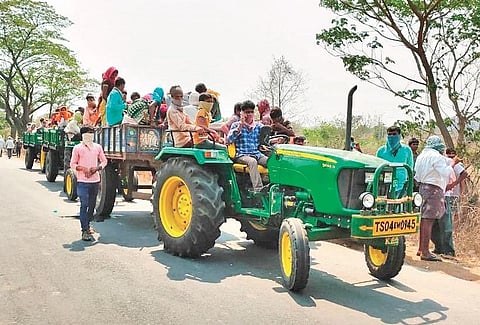 Migrant labourers being transported on tractors to a temporary shelter at Patamata Narasapuram village in Kothagudem on Wednesday